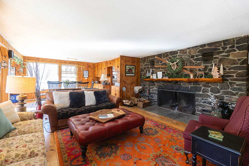 The fieldstone fireplace was constructed in 1949 and is still the heart of Timberholm Inn.